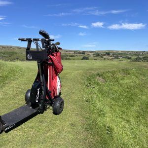 FliCart ride-on golf caddy atop the hills of a golf course